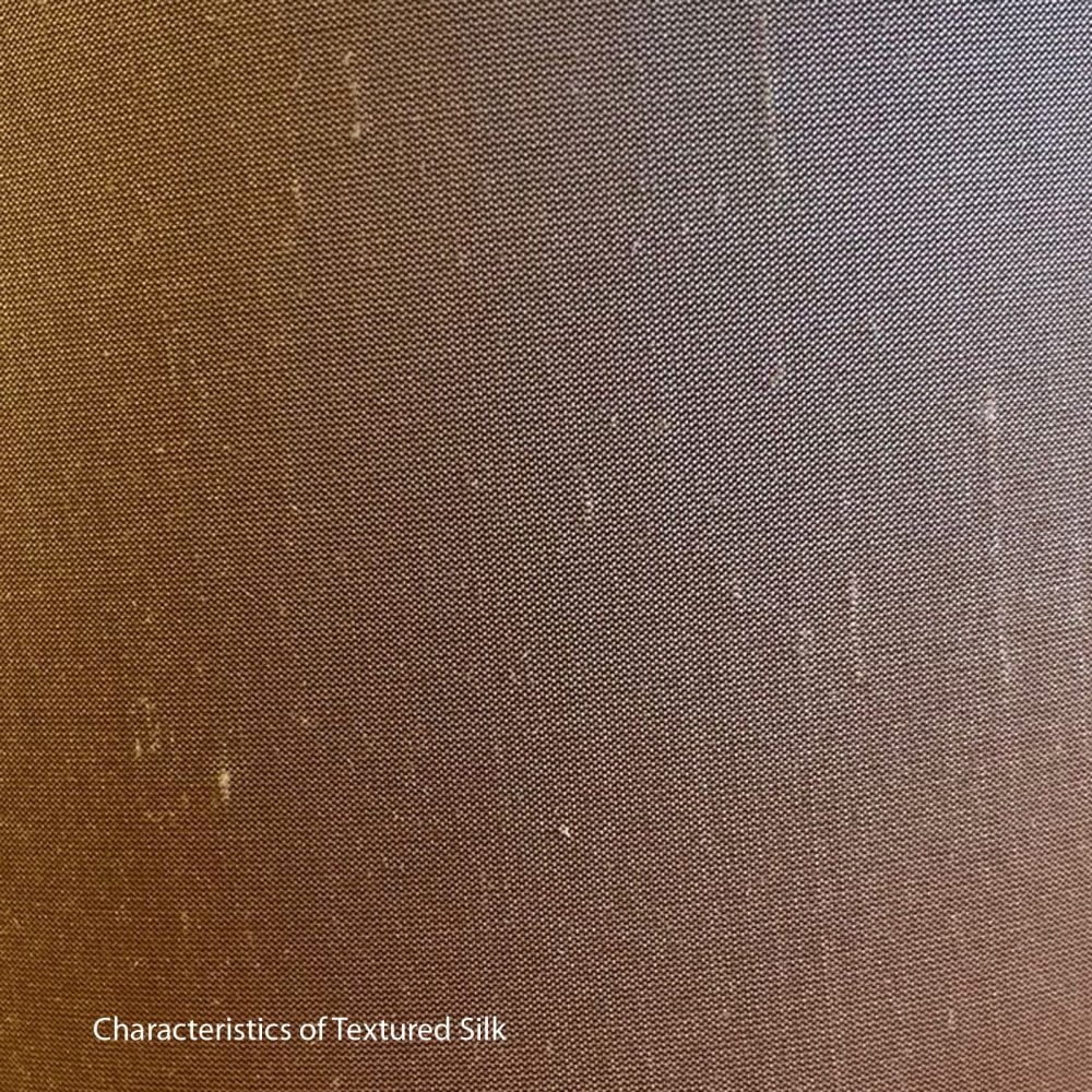 Brown textured silk fabric with small white flecks
