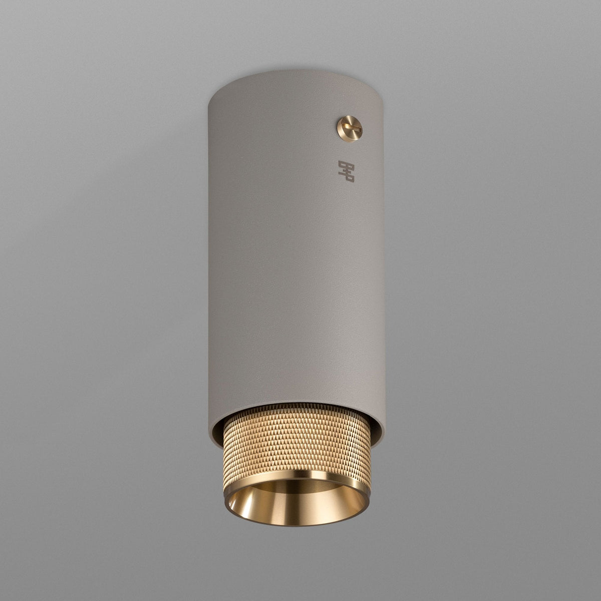 Exhaust Surface Mounted Downlight in a Stone Finish with Brass Detail