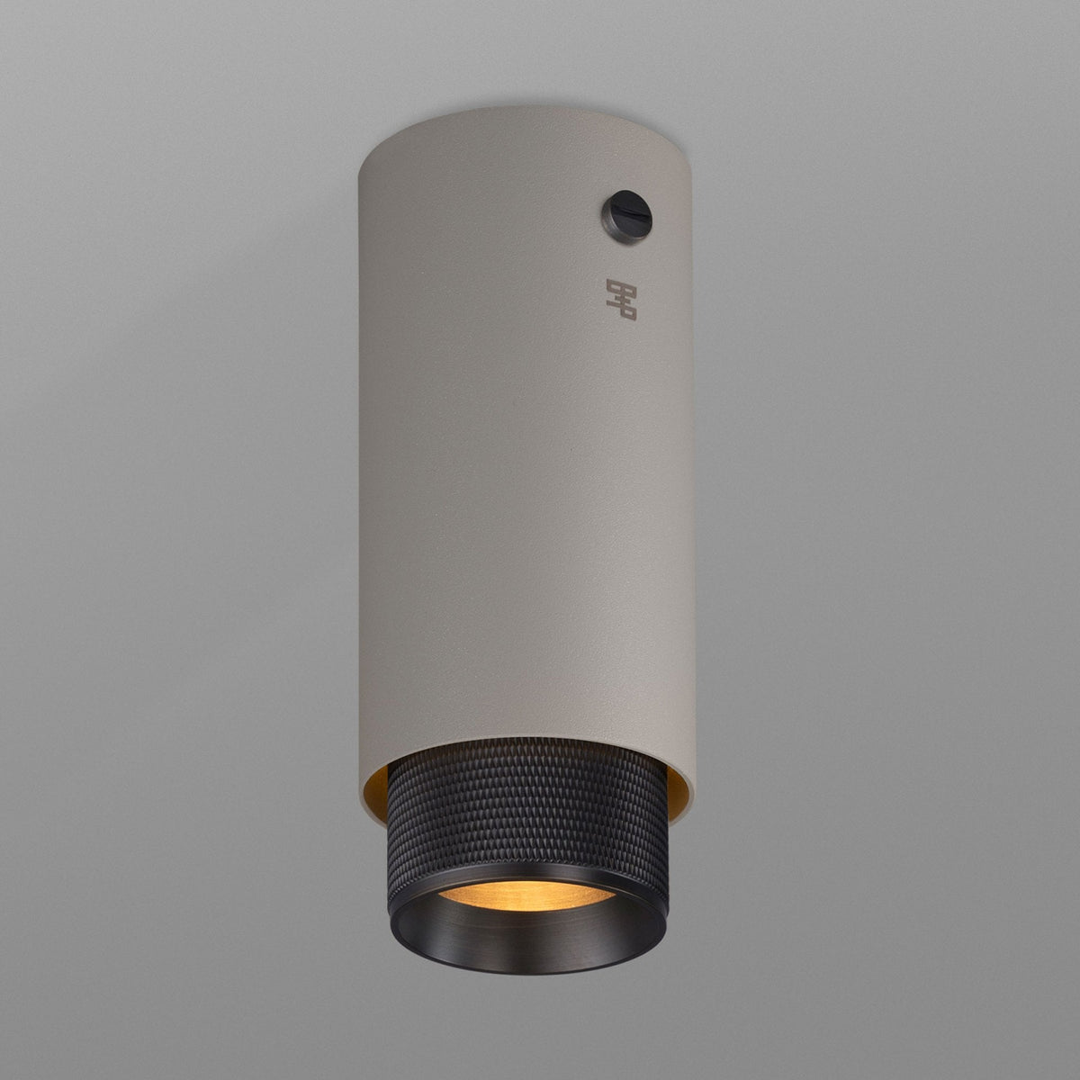 Exhaust Surface Mounted Downlight in a Stone Finish with Smoked Bronze Detail