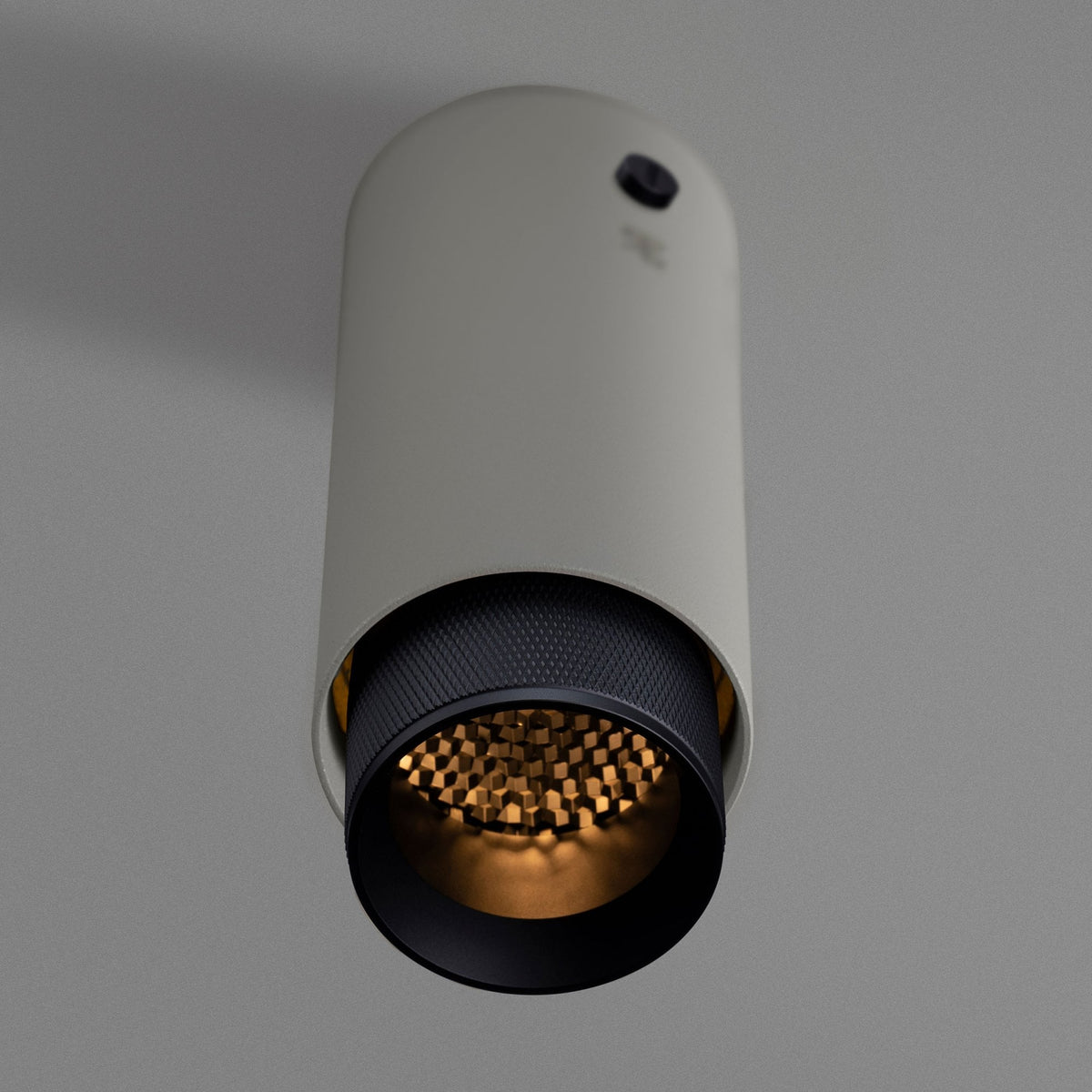 Exhaust Surface Mounted Downlight in a Stone Finish with Black Detail