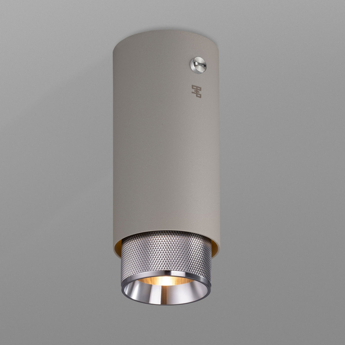Exhaust Surface Mounted Downlight in a Stone Finish with Steel Detail