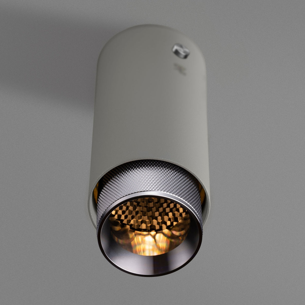 Exhaust Surface Mounted Downlight in a Stone Finish with Steel Detail