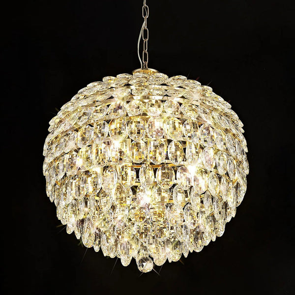 A close-up of a radiant crystal chandelier against a dark background, highlighting its glow.
