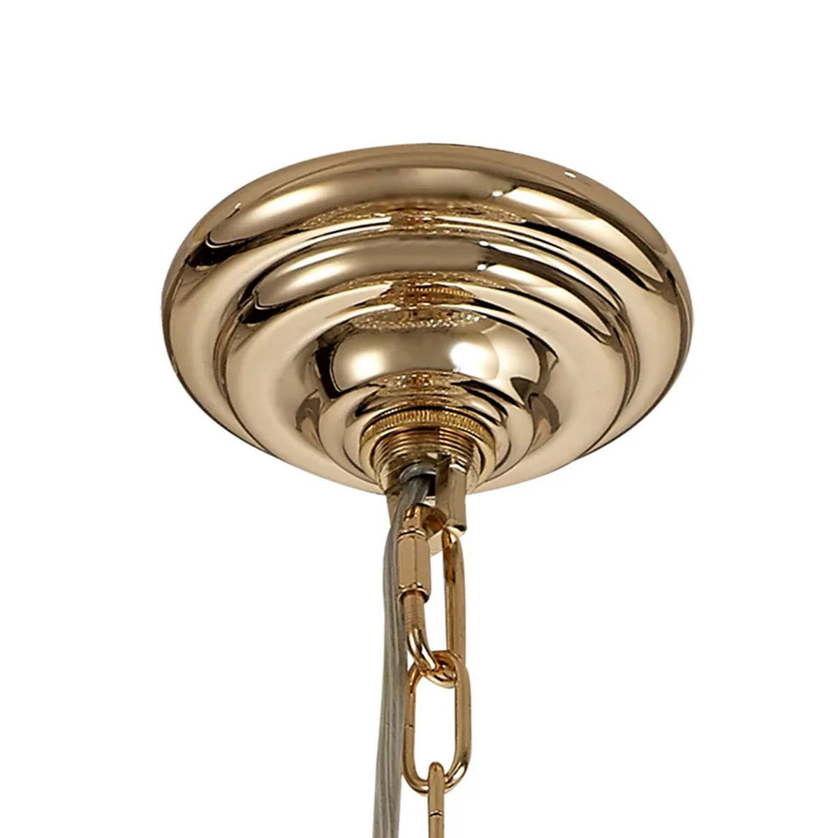 Close-up of the polished gold ceiling rose and chain of a chandelier.