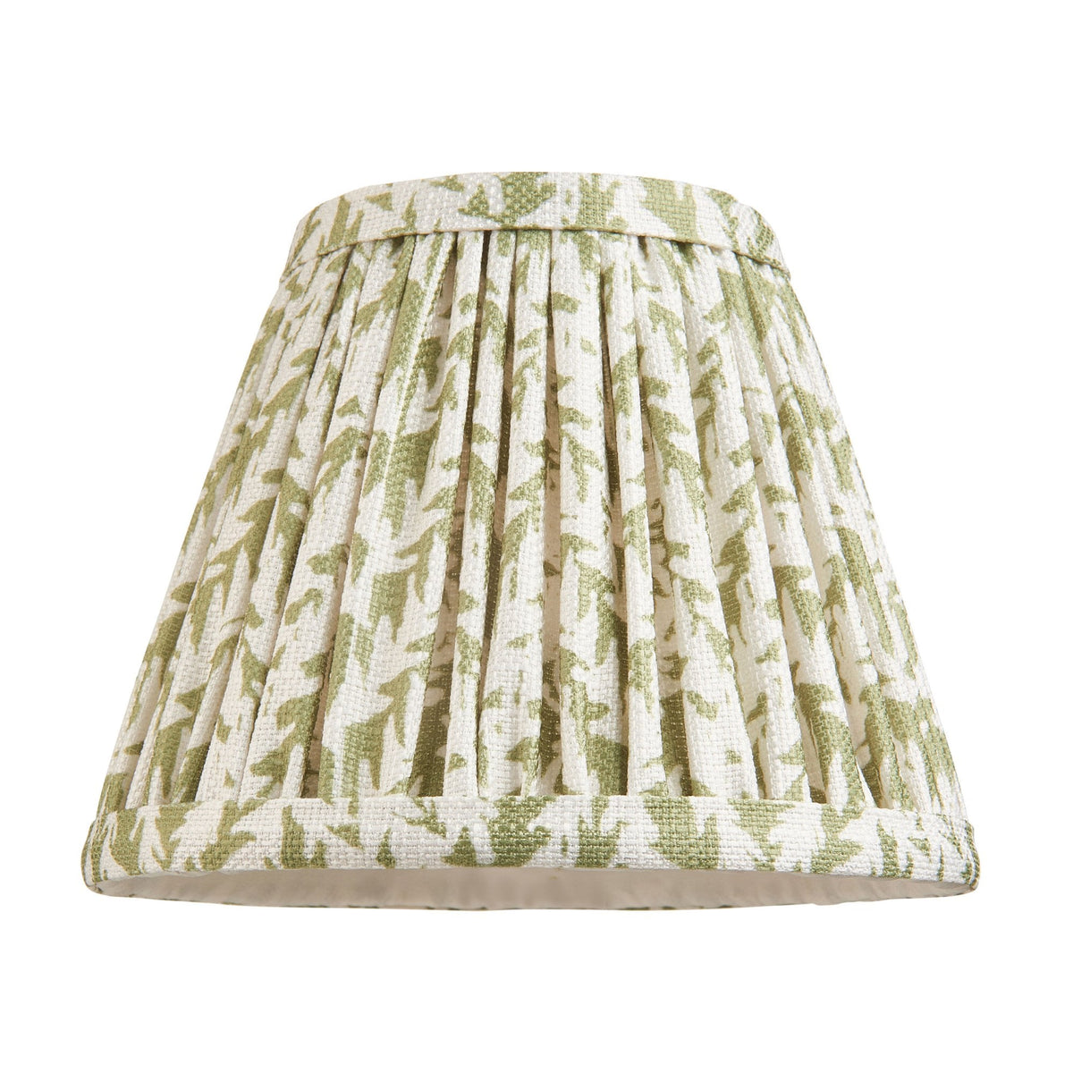 A pleated lamp shade with a green and white abstract pattern on a white background.