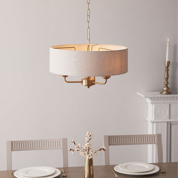 Highclere Three Light Pendant in Vintage Brass with Natural Shade
