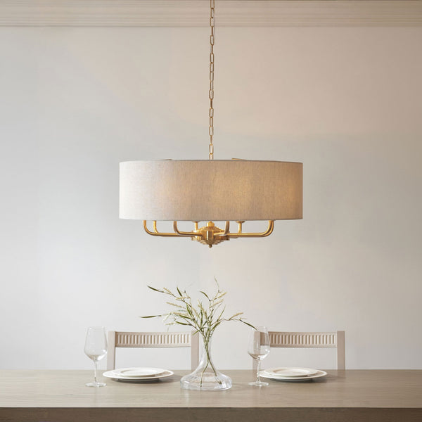 Highclere Eight Light Pendant in Vintage Brass with Natural Shade