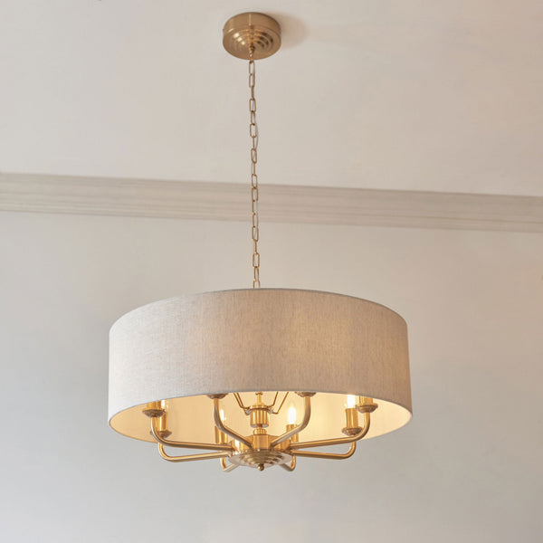Highclere Eight Light Pendant in Vintage Brass with Natural Shade