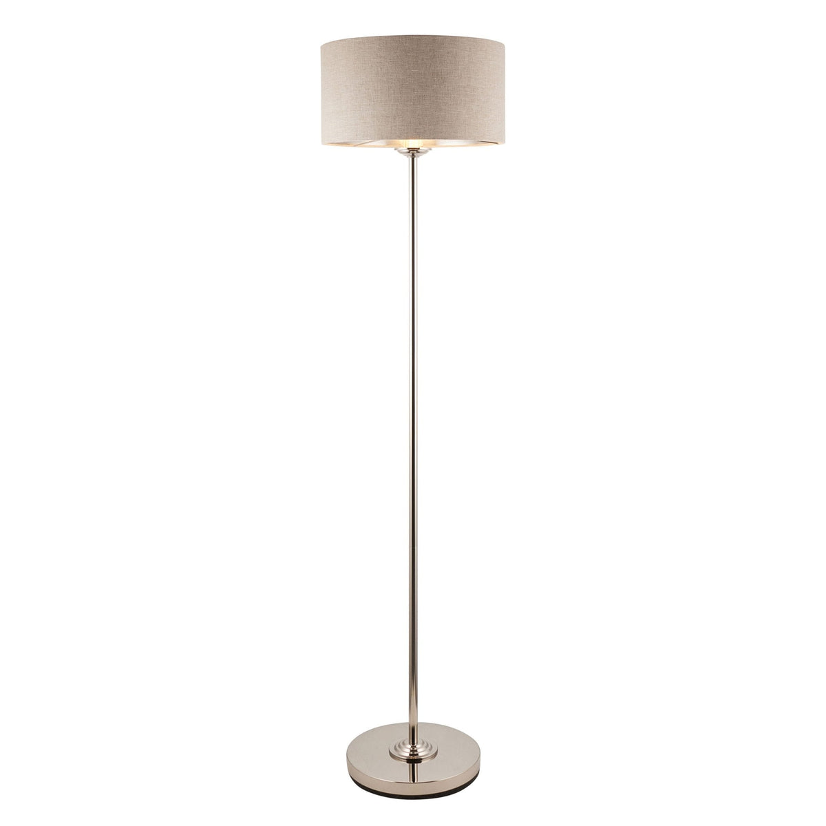 A tall, slender floor lamp with a beige drum shade and a polished silver finish on a white background.