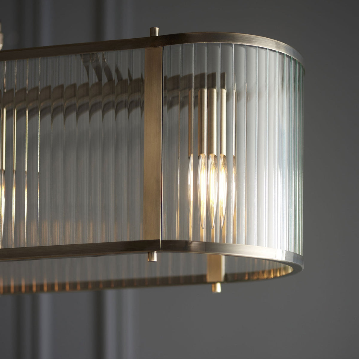 Ridgeton Linear Pendant Light in Antique Brass & Clear Ribbed Glass