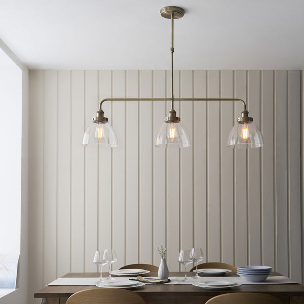 Hansen Triple Light Linear Pendant in Antique Brass and Clear Glass Shades