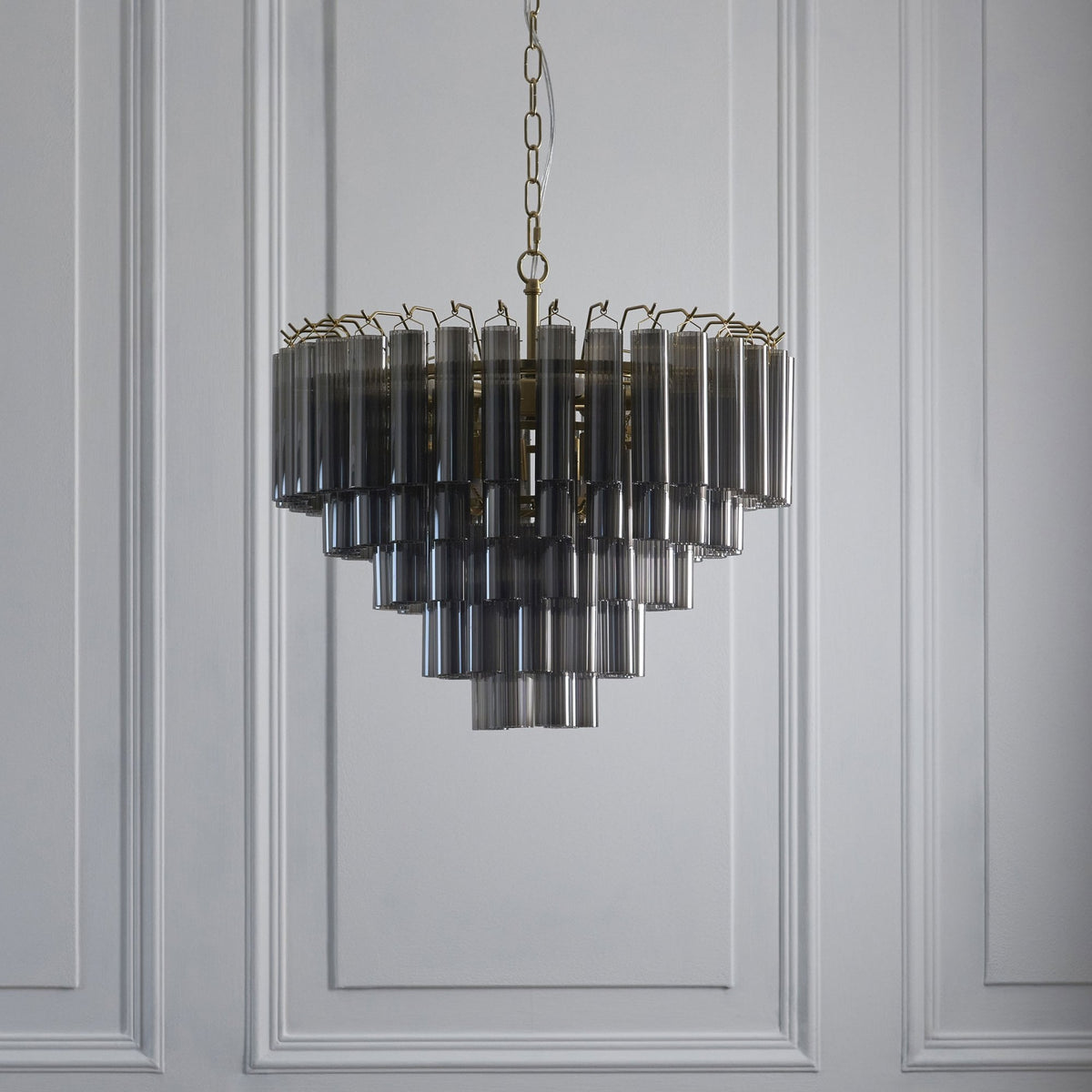 Toulouse Twelve Light Tiered Pendant in Brushed Gold with Ribbed Cylindrical Smokey Glass