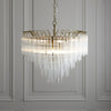 Toulouse Twelve Light Tiered Pendant in Brushed Gold with Ribbed Cylindrical Clear Glass