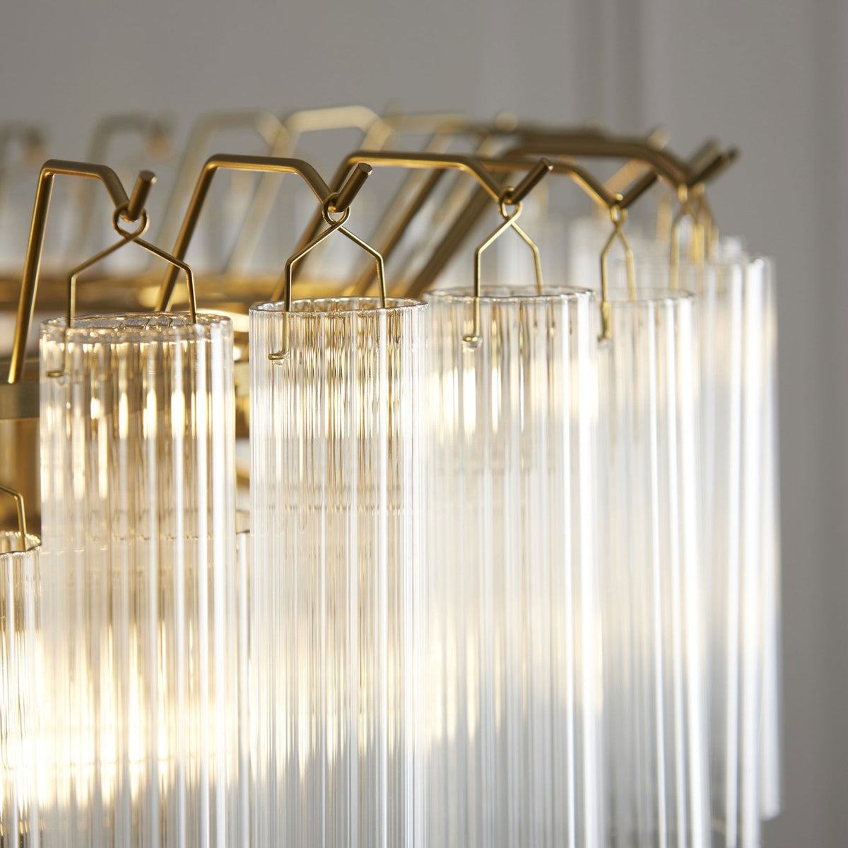 Toulouse Twelve Light Tiered Pendant in Brushed Gold with Ribbed Cylindrical Clear Glass