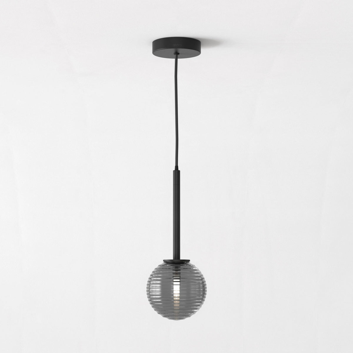 Black pendant light with a ribbed, spherical glass shade