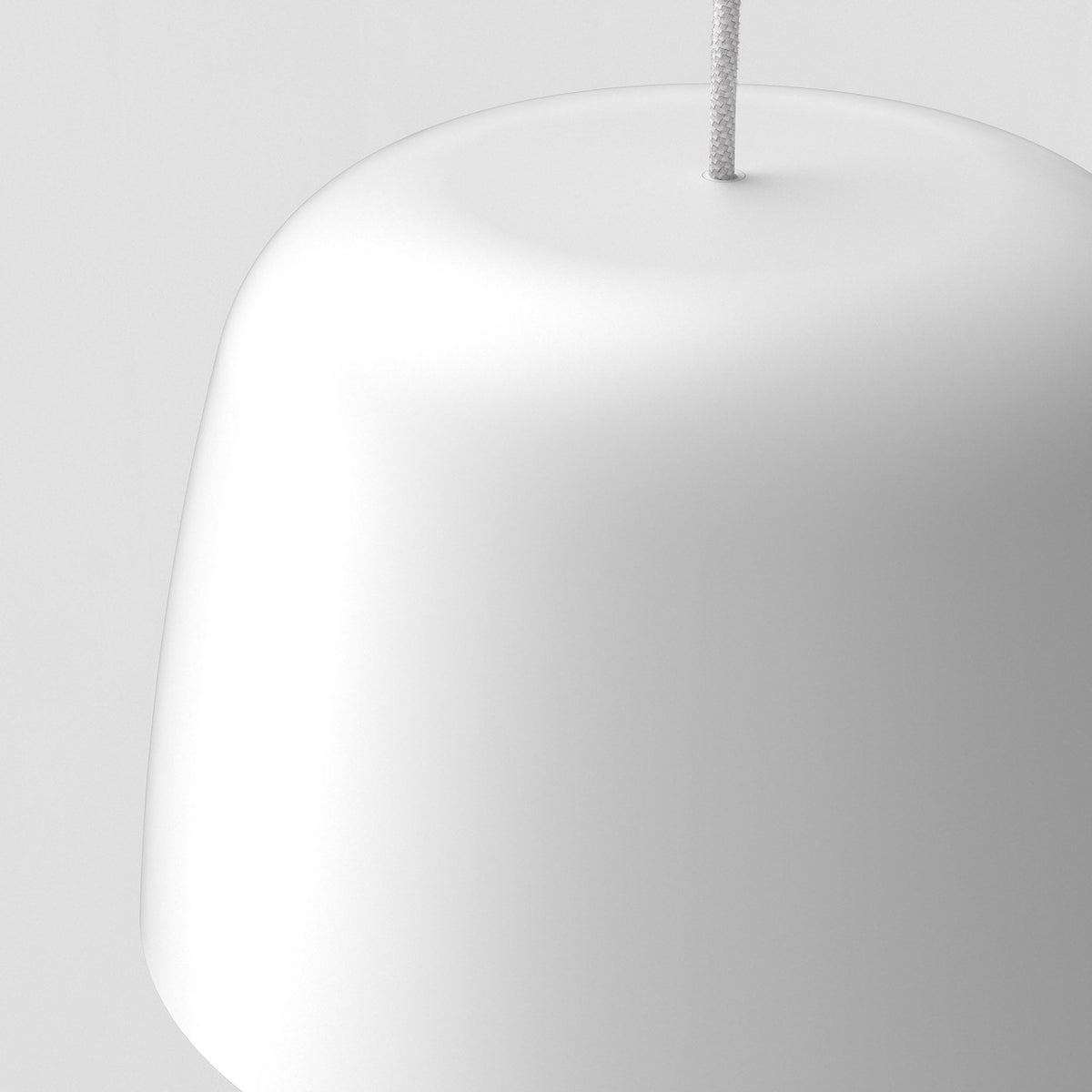White pendant light with a textured cord