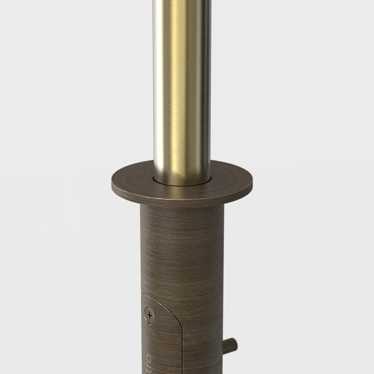 Close up of a brushed brass cylindrical lamp post with a dark bronze base and a circular flange