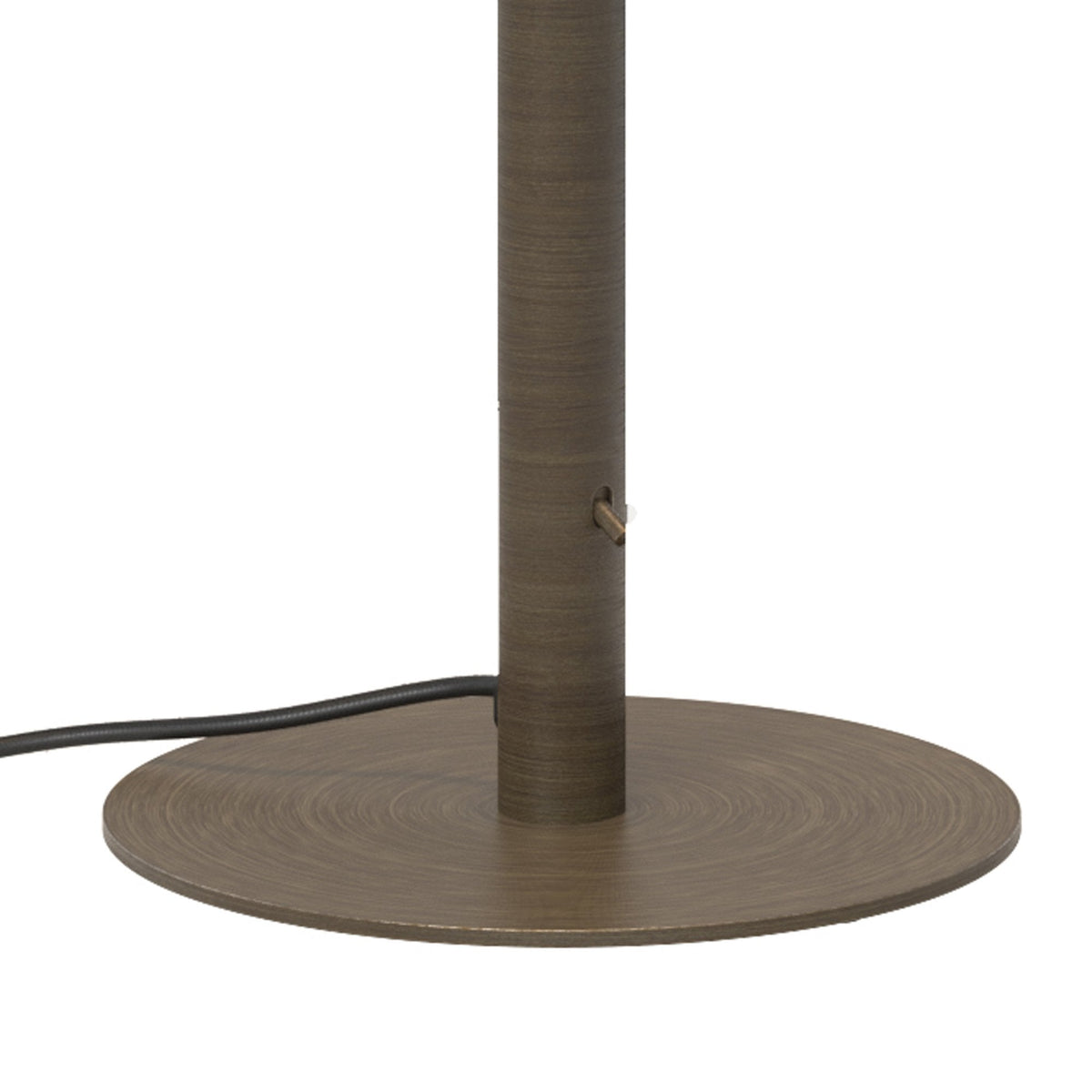 Close up of a bronze lamp base with a black cord