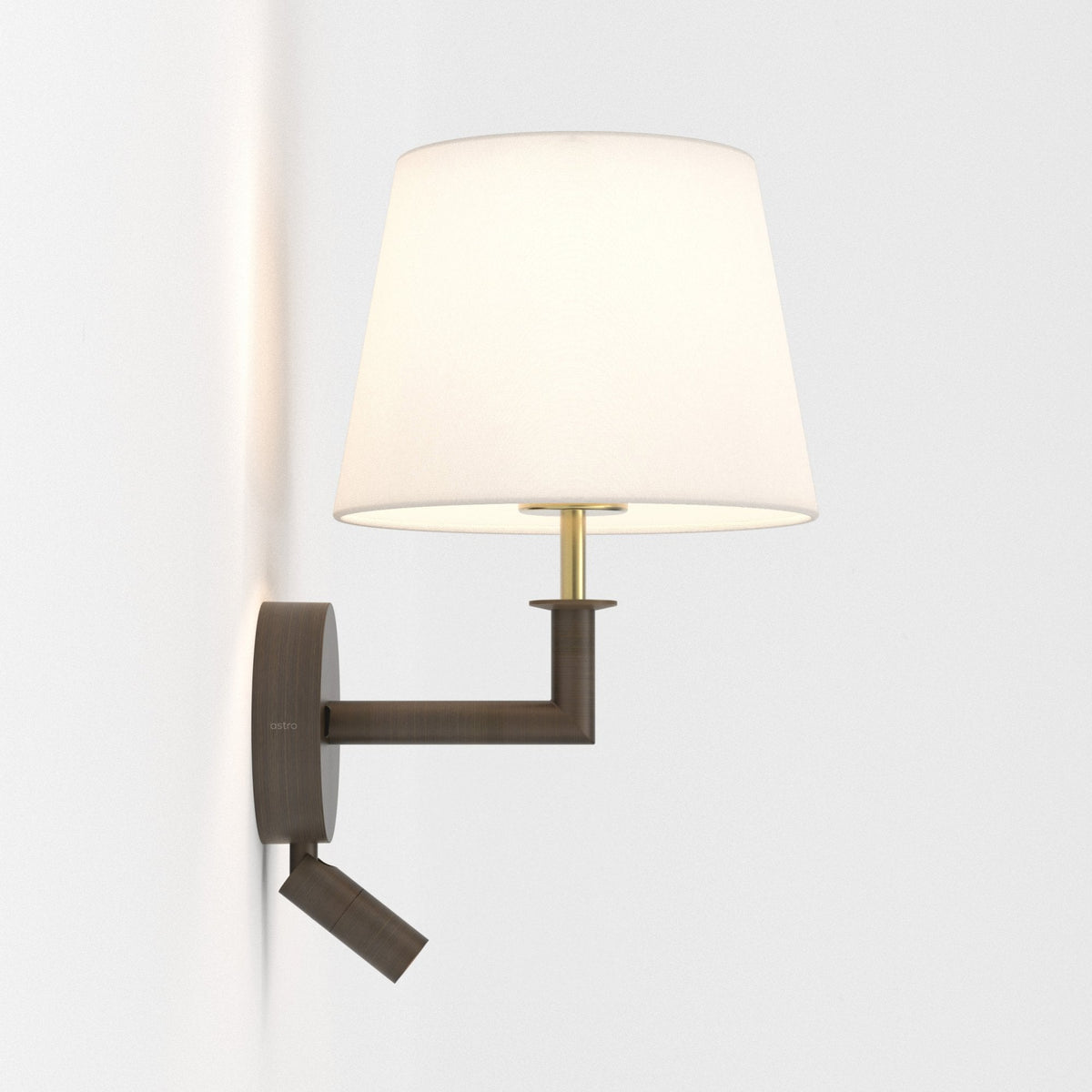Bronze wall light with a white fabric shade and an adjustable reading light