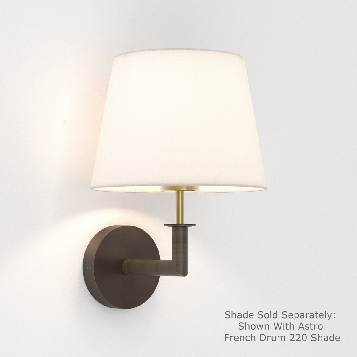 Bronze wall light with a white fabric shade