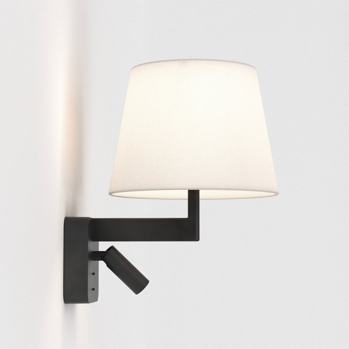 Black wall lamp with a white conical shade and an adjustable spotlight