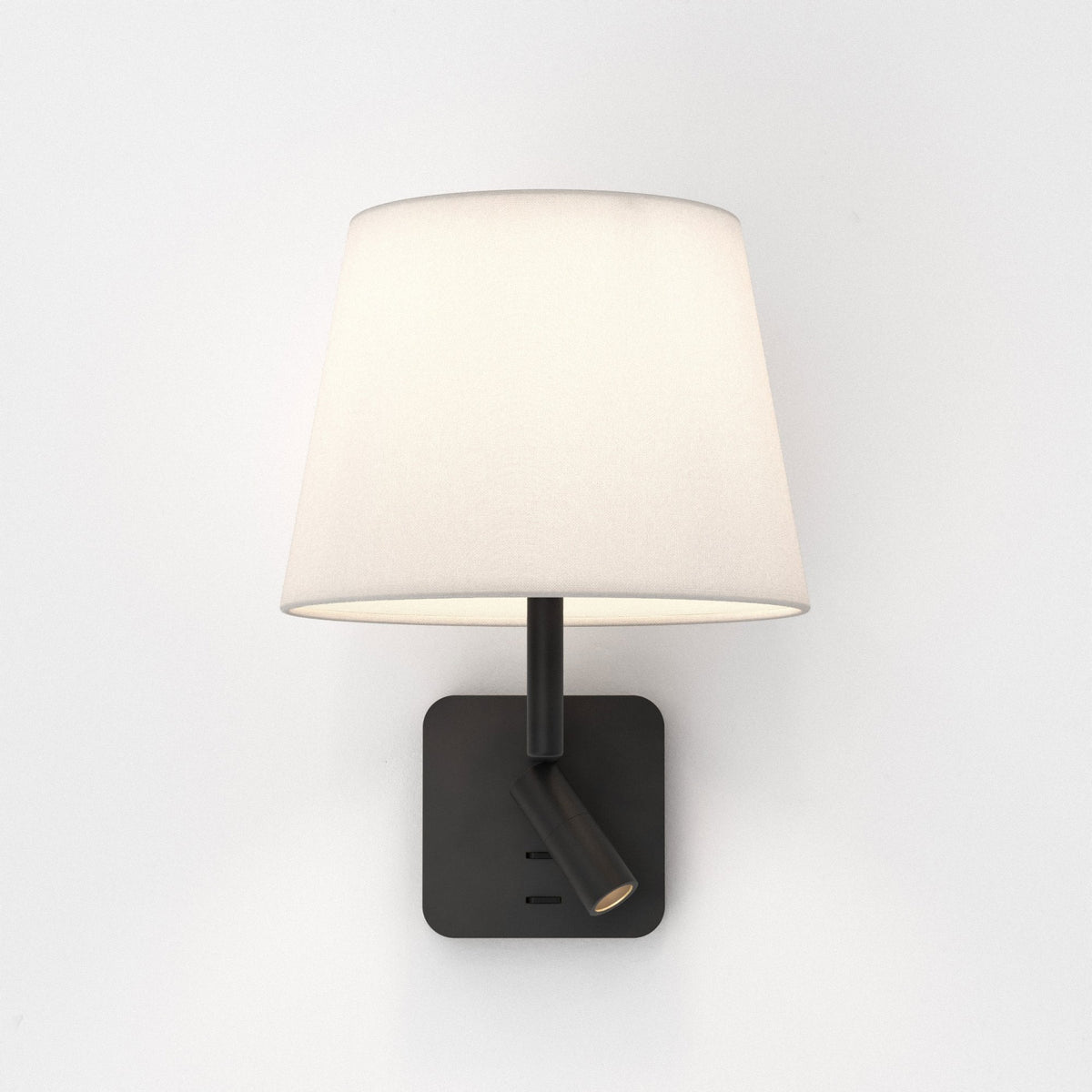 Wall-mounted lamp with a white fabric shade and a black base with an adjustable spotlight