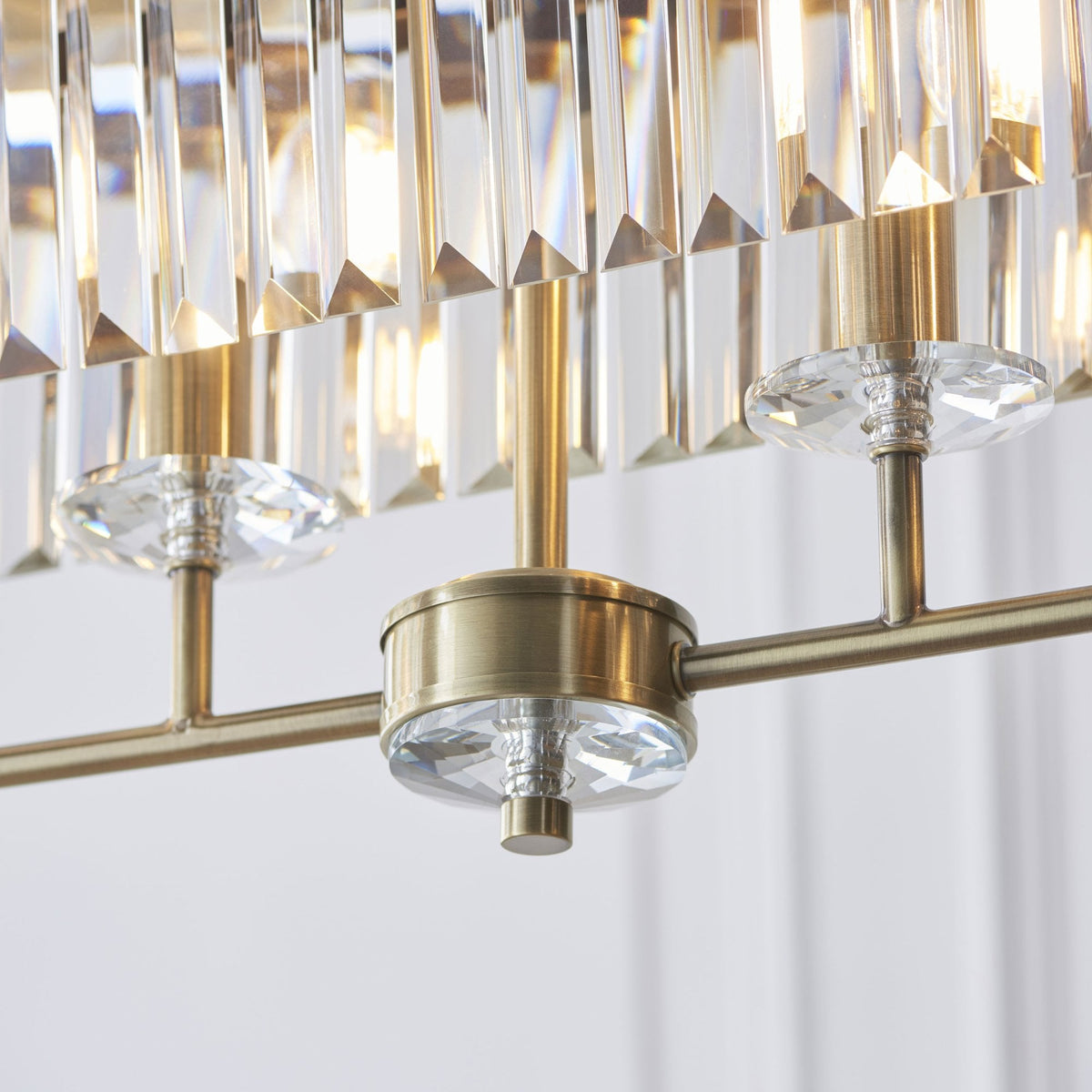 Yetminster 4 Light Linear Pendant in Antique Brass & Clear Cut Glass