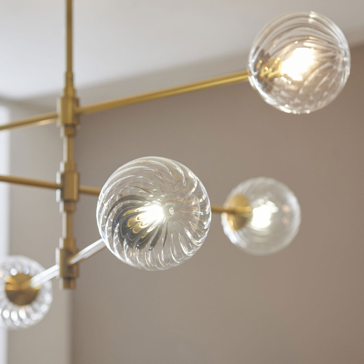 Selston Six Light Tiered Pendant in Brushed Aged Brass with Clear Twisted Pattern Glass