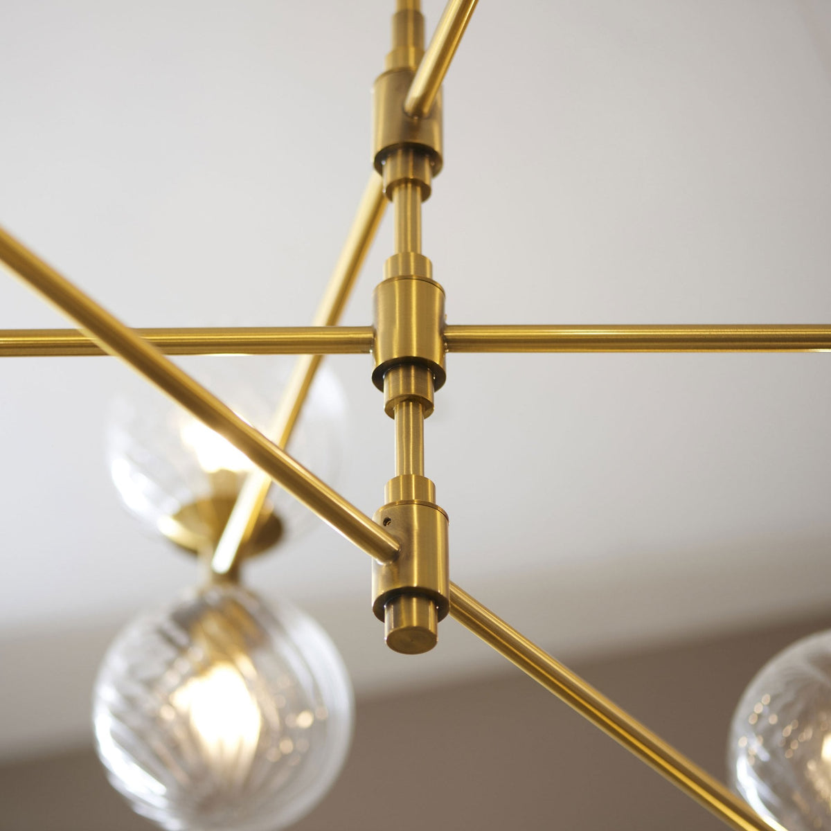 Selston Twelve Light Tiered Pendant in Brushed Aged Brass with Clear Twisted Pattern Glass