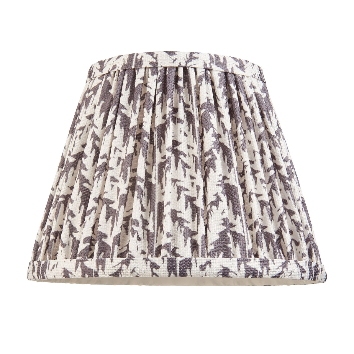 A grey and white patterned pleated lampshade on a white background.