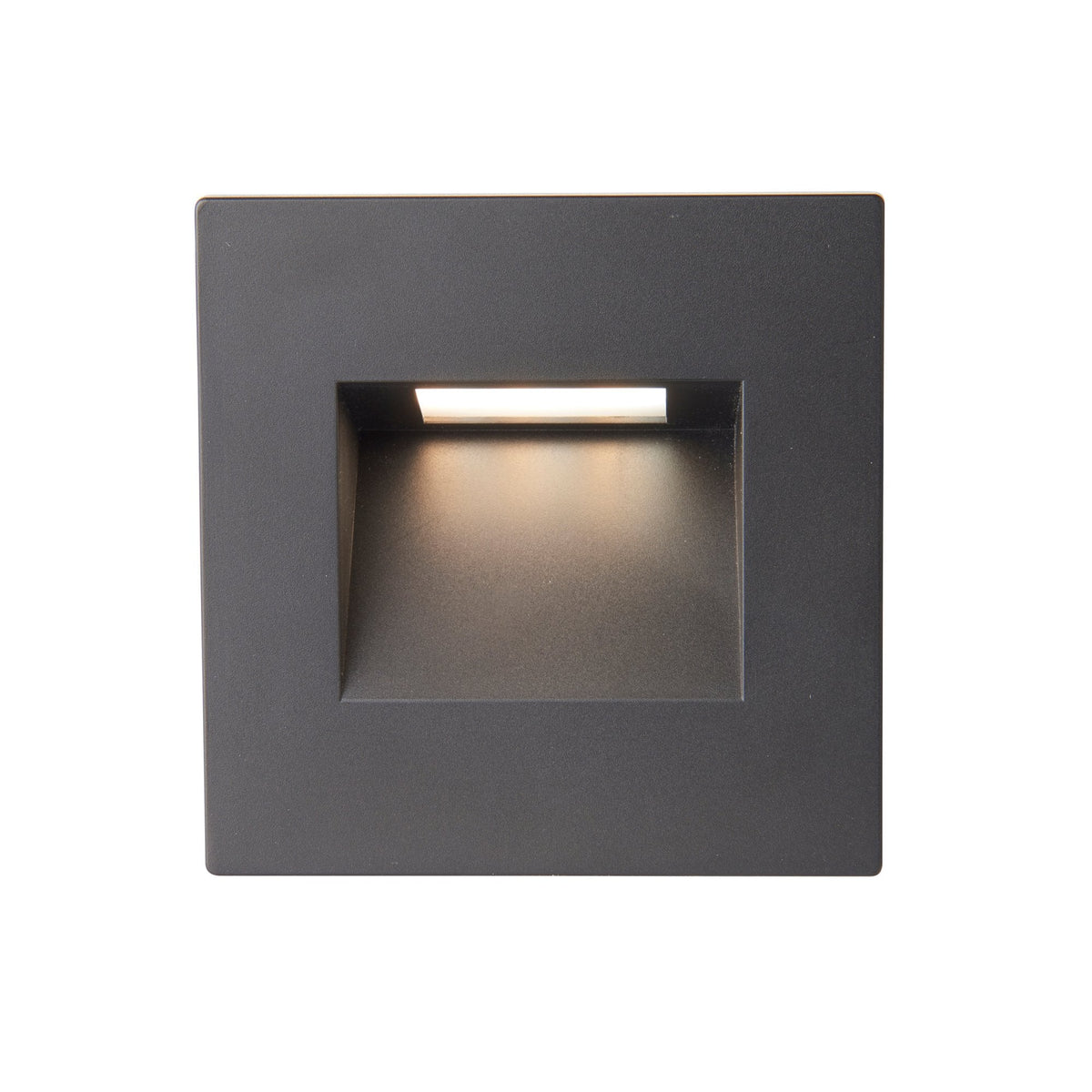A black square recessed wall light with warm light.