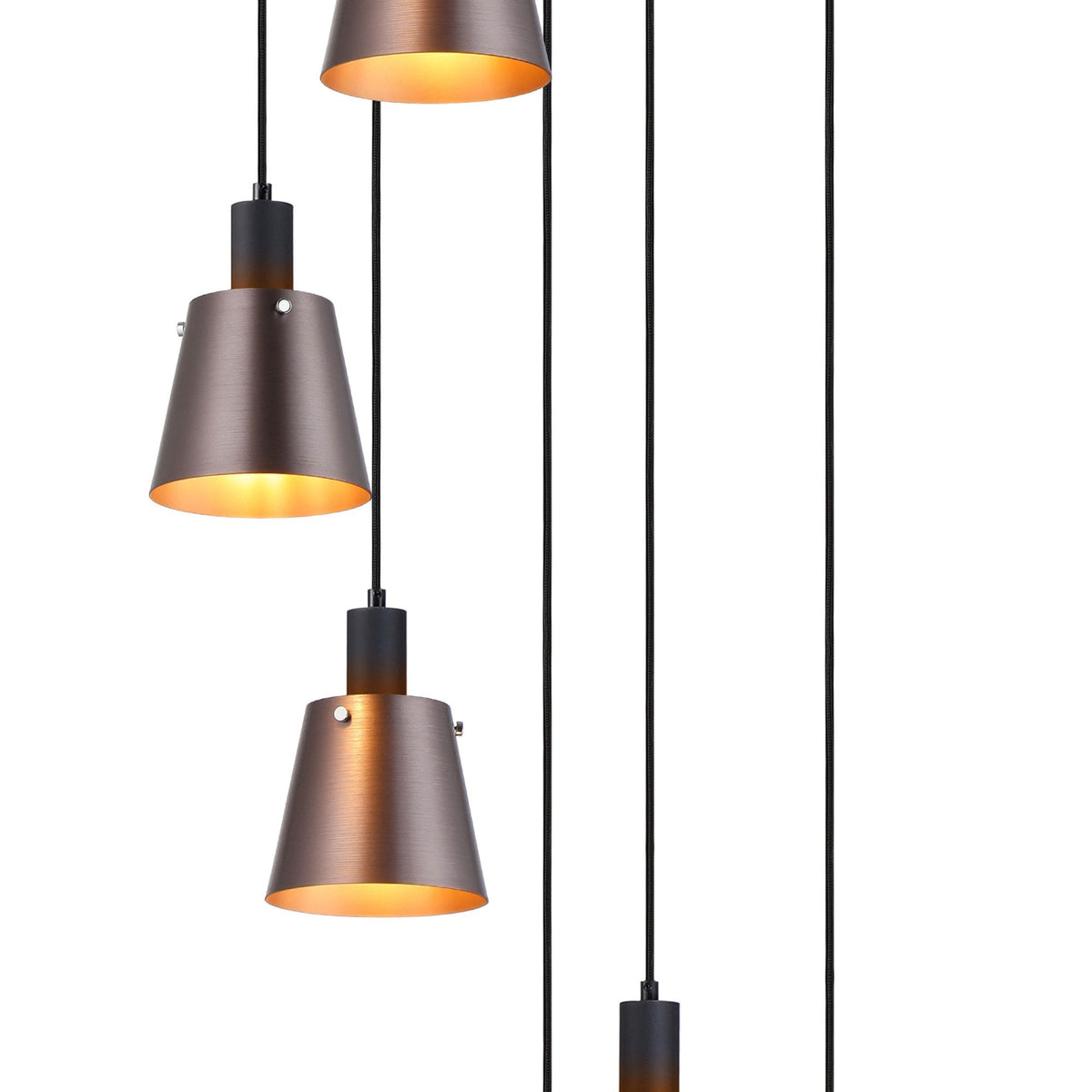 Close-up of three antique copper and black pendant lights with illuminated interiors.