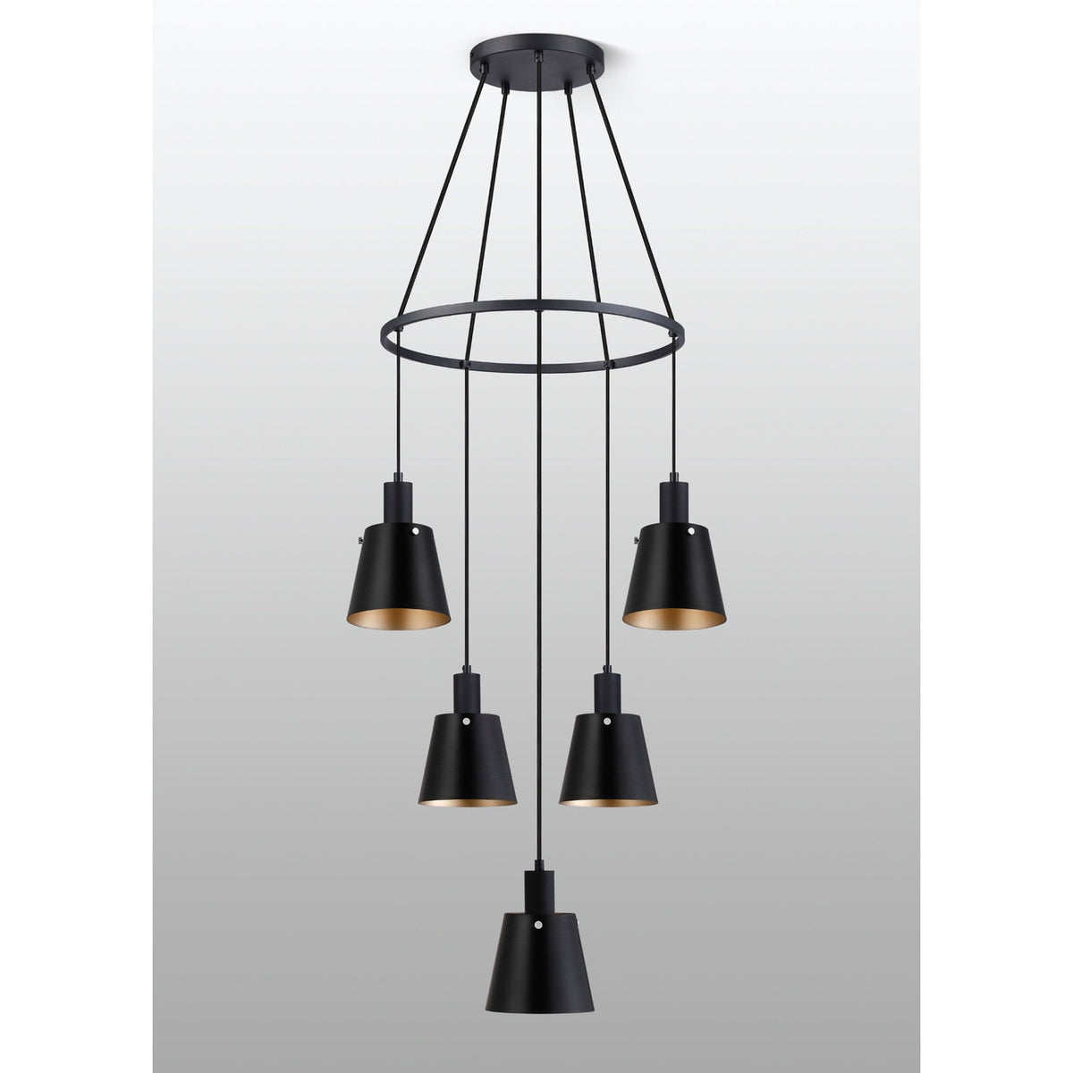 Black five-light chandelier with illuminated gold-lined conical shades on a grey background.