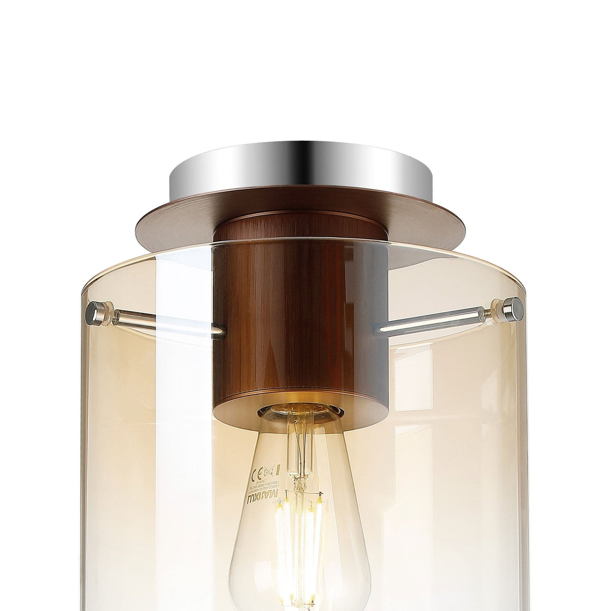 A close-up of the top portion of a ceiling light with an amber-tinted glass shade.