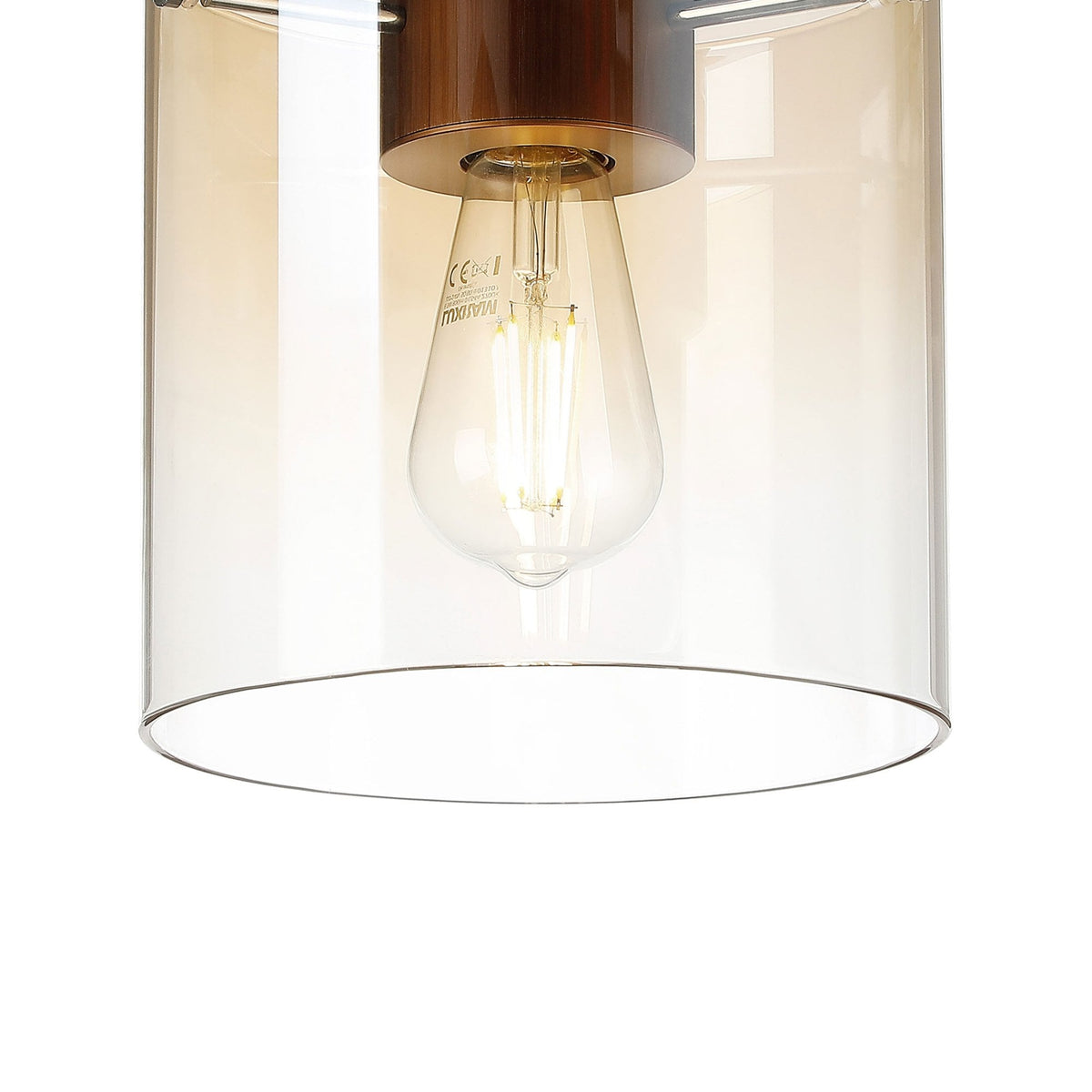 A close-up of the bottom portion of a ceiling light with an amber-tinted glass shade.