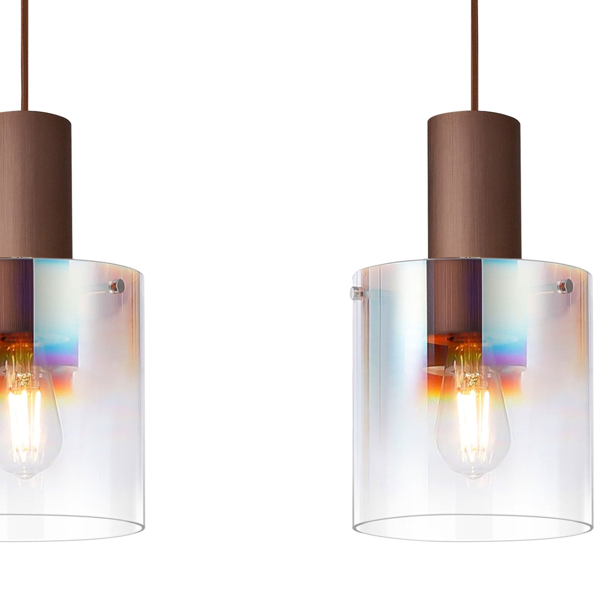 Two of the three pendant lights, highlighting the clear shades and bronze tops.