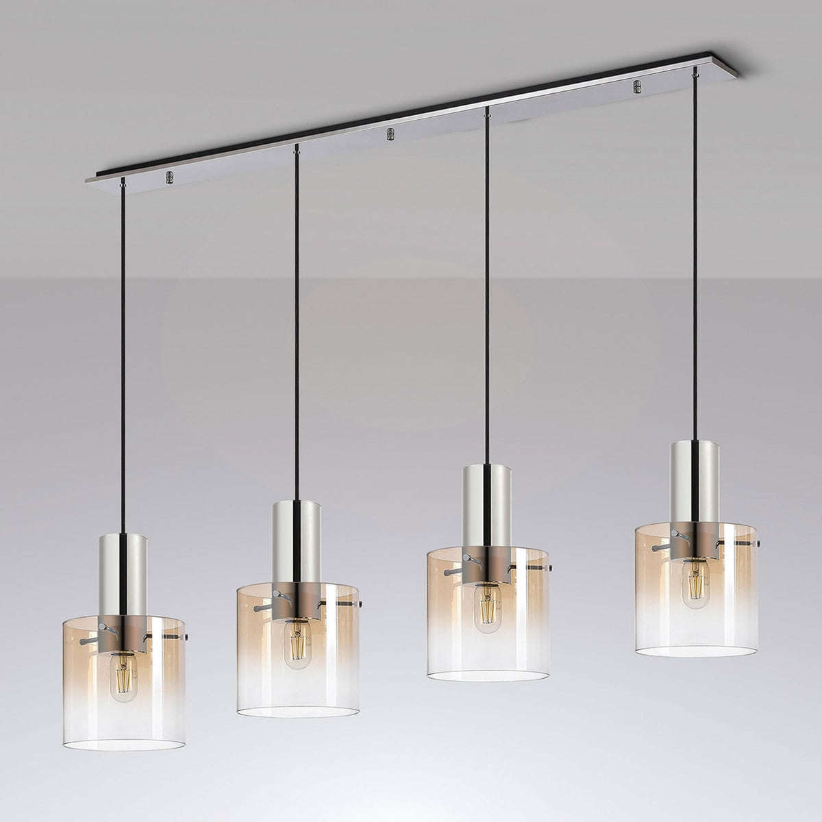 Four amber gradient glass pendant lights with chrome tops, suspended from a rectangular ceiling fixture.