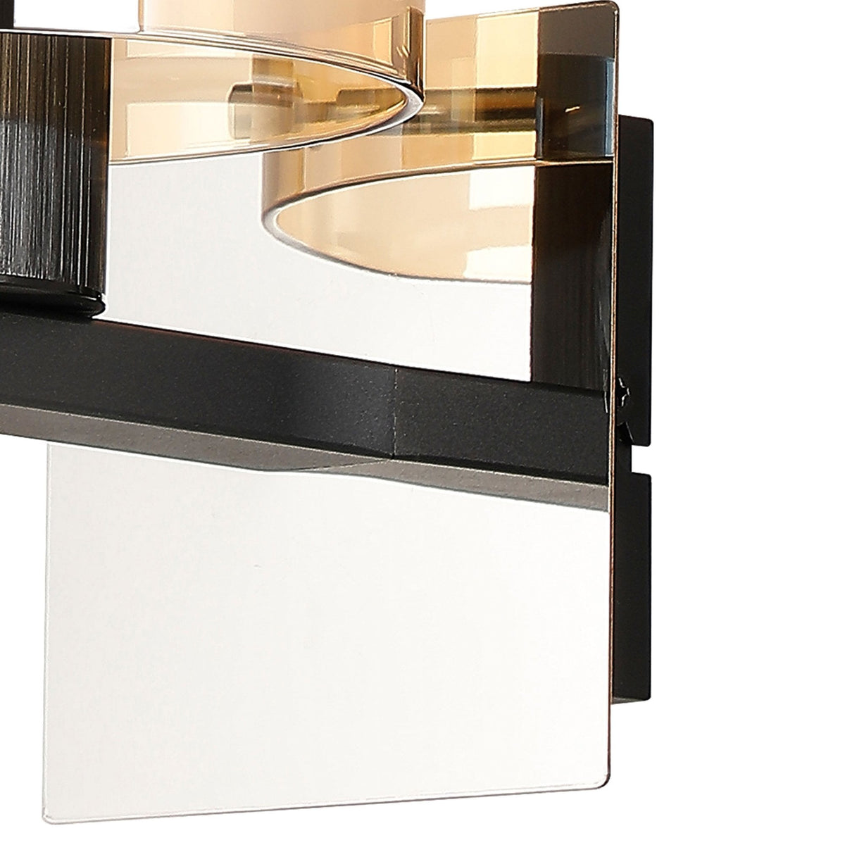 Close-up of the modern wall light's base, showing the black bracket and clear glass panel.