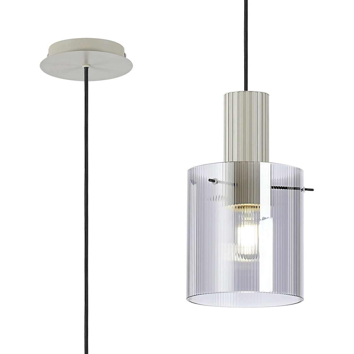 Close-up of a pendant light with a clear, ribbed glass shade and a white fitting.