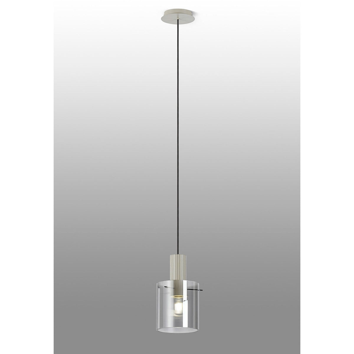 Full view of the illuminated pendant light with a clear, ribbed glass shade against a grey background.