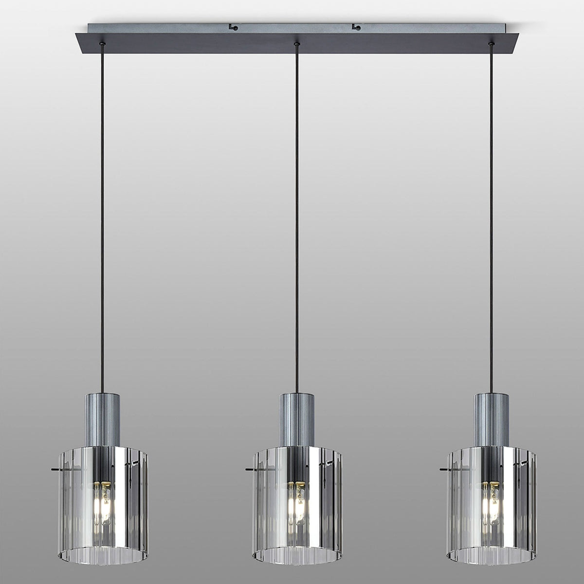 Three pendant lights with ribbed glass shades hang from a rectangular bar.