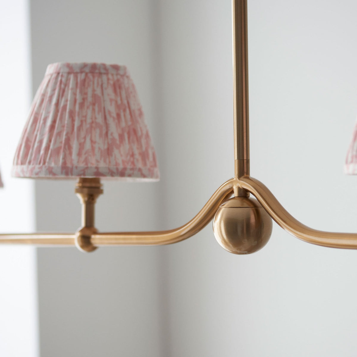 Santiago Four Lamp Linear Pendant in Brushed Aged Brass with Leaf 16cm Peachy Keen Shade