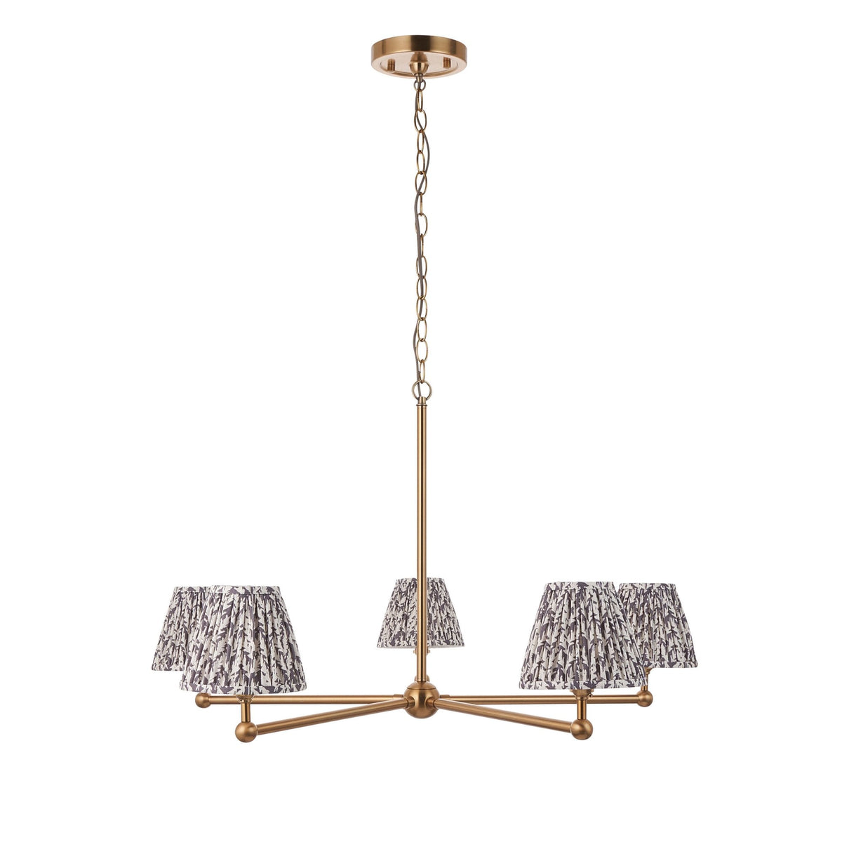 A brass chandelier with five patterned pleated lampshades against a white background.