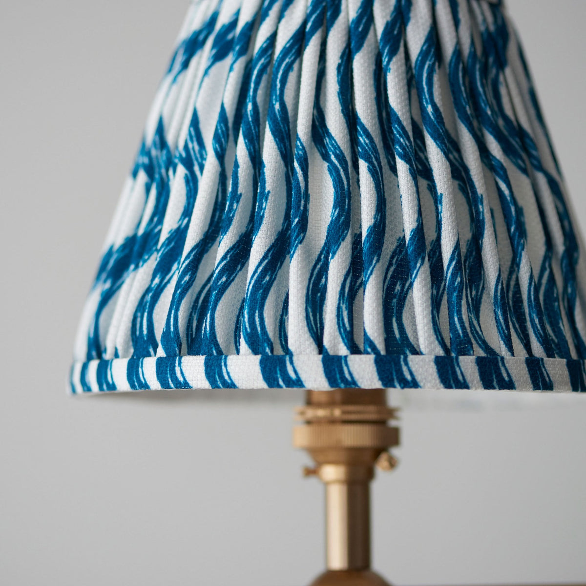 Santiago Four Lamp Linear Pendant in Brushed Aged Brass with Ripple 16cm Marlin Blue Shade