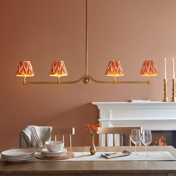 Santiago Four Lamp Linear Pendant in Brushed Aged Brass with Zigzag 16cm Apricot Orange Shade