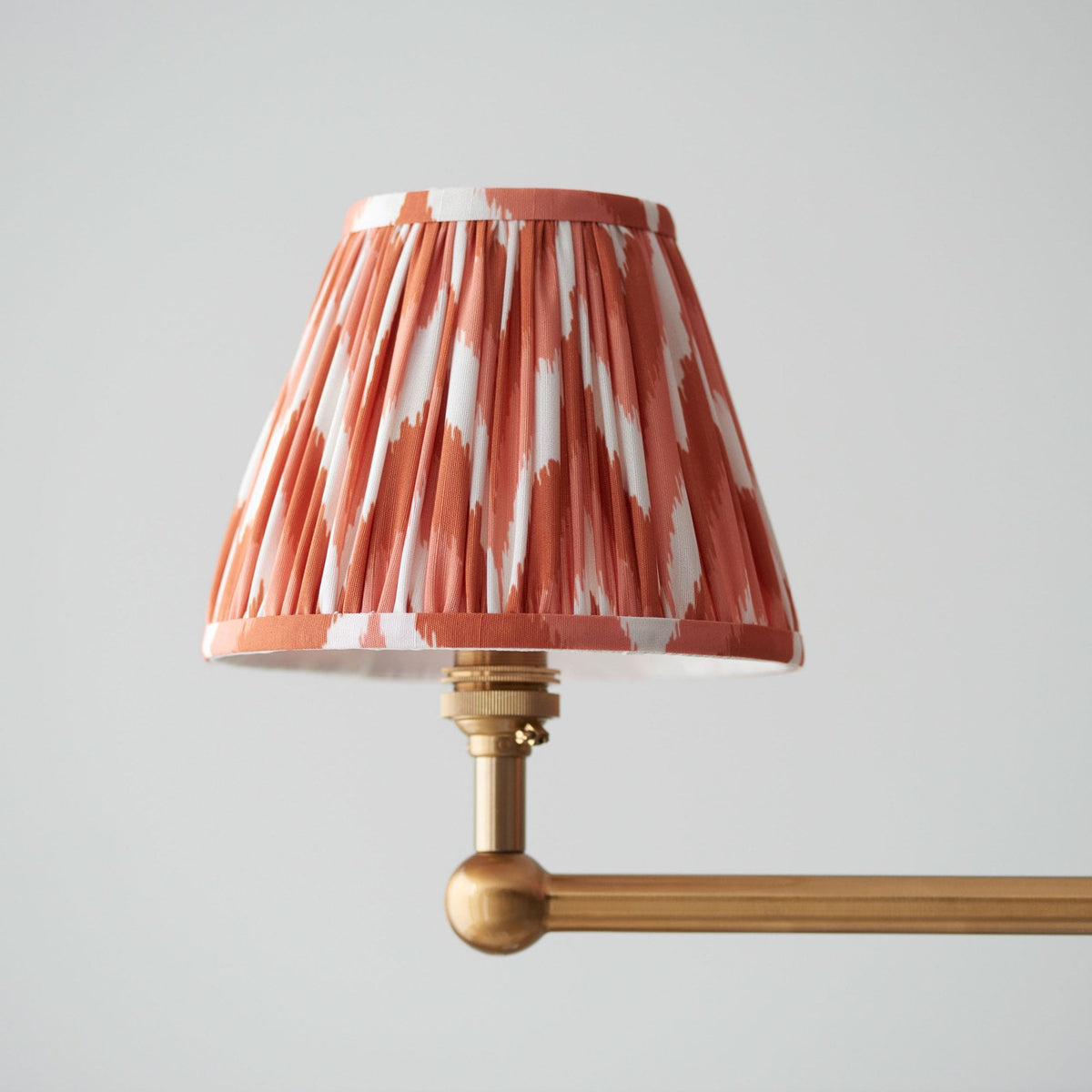 Santiago Four Lamp Linear Pendant in Brushed Aged Brass with Zigzag 16cm Apricot Orange Shade
