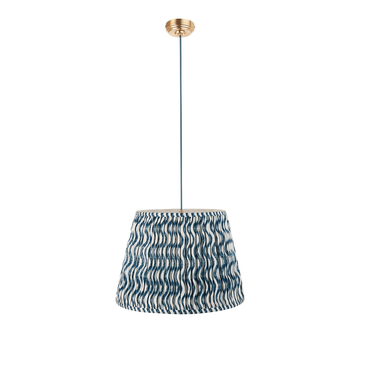 A pleated blue and white patterned lampshade with a brass ceiling rose on a white background.