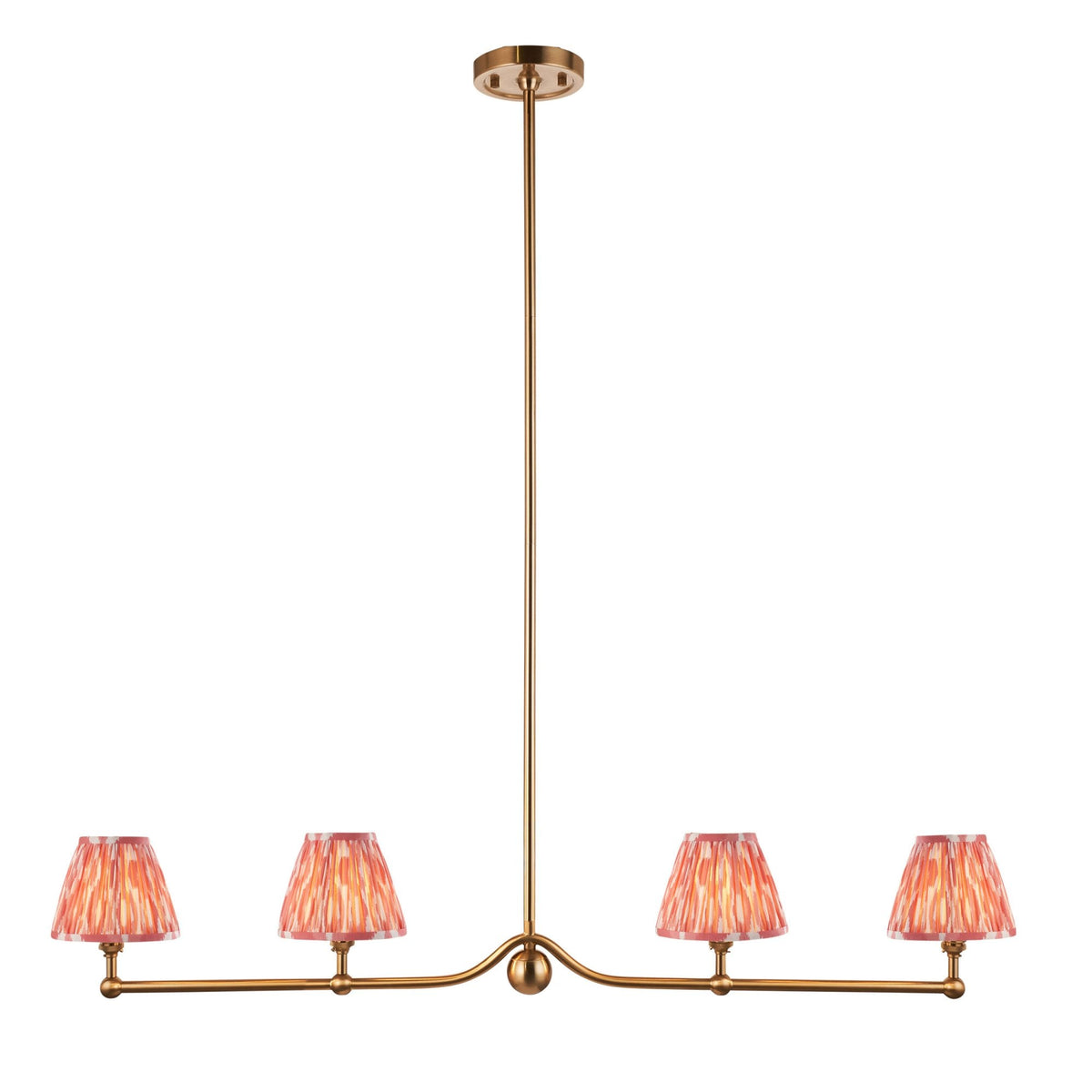A four-light pendant with amber-red pleated shades against a stark white background.