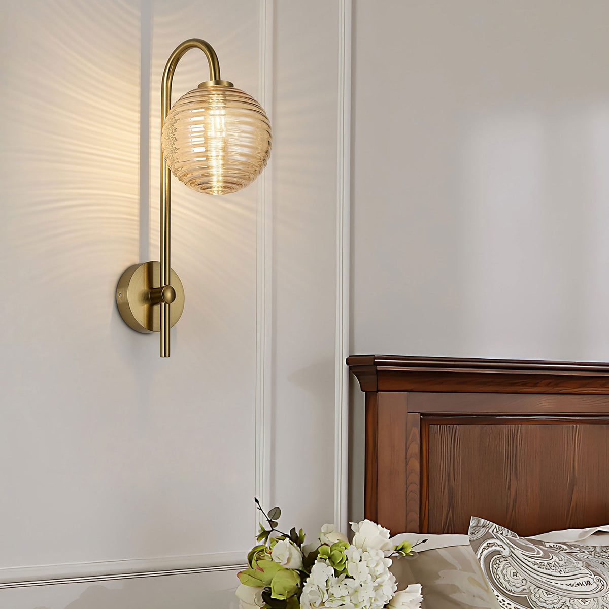 Tenterden Curved Arm IP44 Wall Light in Brass Gold with Ribbed Round Amber Glass Diffuser