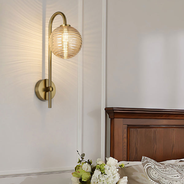 Tenterden Curved Arm IP44 Wall Light in Brass Gold with Ribbed Round Amber Glass Diffuser